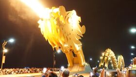 Group taking photos at Da Nang Dragon Bridge